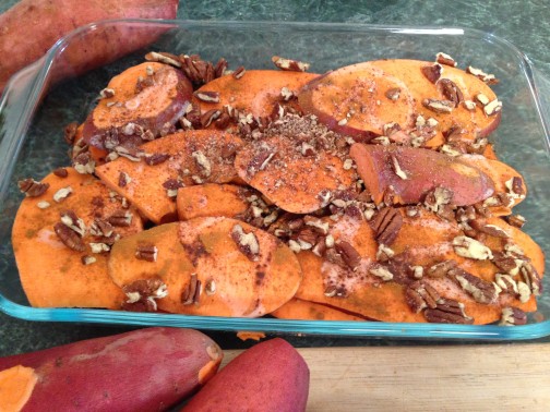 Pecan Baked Sweet Potatoes in glass pyrex dish ready to go into the oven