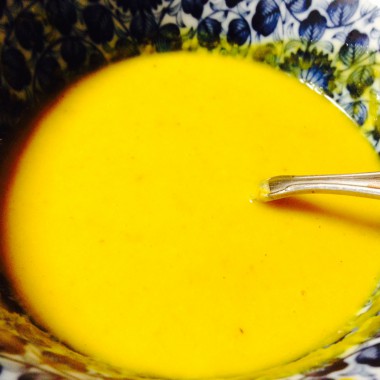 Bowl of Curried Squash or Pumpkin Soup with a spoon