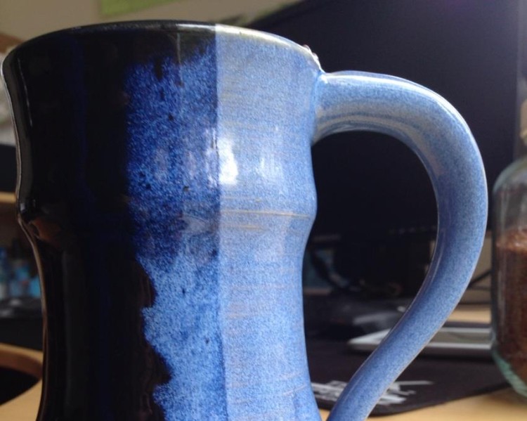 Blue Mug with a cold killer hot drink
